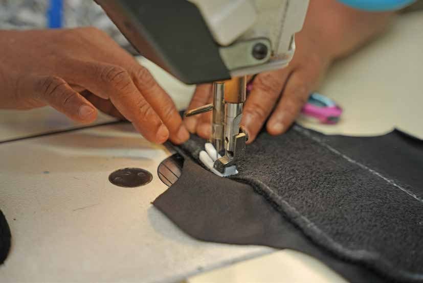 A reusable pad being stitched on the sewing floor